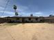 Large backyard featuring a patio, solar panels, and minimal landscaping at 4823 W Palm Ln, Phoenix, AZ 85035