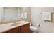 Bathroom features a single sink, toilet, and shower with curtain at 5450 E Deer Valley Dr # 1214, Phoenix, AZ 85054