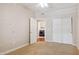 Spacious bedroom features carpeting, closet, and ceiling fan at 5450 E Deer Valley Dr # 1214, Phoenix, AZ 85054