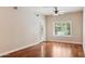 Spacious bedroom featuring hardwood floors, a ceiling fan and a bright window at 5450 E Deer Valley Dr # 1214, Phoenix, AZ 85054