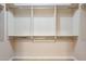 Walk-in closet features custom built-in shelving and hanging racks at 5450 E Deer Valley Dr # 1214, Phoenix, AZ 85054