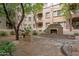 Beautiful courtyard setting with stone fireplace and shaded seating areas for relaxing and socializing at 5450 E Deer Valley Dr # 1214, Phoenix, AZ 85054
