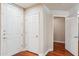 Welcoming foyer featuring pristine white doors, gleaming wood floors, and neutral wall tones at 5450 E Deer Valley Dr # 1214, Phoenix, AZ 85054