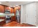 Bright kitchen features stainless steel appliances, wooden cabinetry and hardwood floors at 5450 E Deer Valley Dr # 1214, Phoenix, AZ 85054
