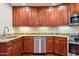 Well-equipped kitchen featuring rich wood cabinets, stainless steel appliances, and granite countertops at 5450 E Deer Valley Dr # 1214, Phoenix, AZ 85054
