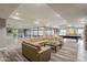 Spacious lounge featuring a large sectional sofa, game room with pool table, and stylish decor at 5450 E Deer Valley Dr # 1214, Phoenix, AZ 85054