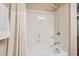 Shower area with grab bar and shower head with handheld wand at 5450 E Deer Valley Dr # 1214, Phoenix, AZ 85054