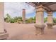 Landscaped clock tower viewed from a paved community space offers a striking focal point at 550 W Powell Way, Chandler, AZ 85248