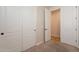 Closet adjacent to a bedroom, next to another closet with double doors; neutral walls and floors at 550 W Powell Way, Chandler, AZ 85248