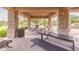 Community gathering area featuring picnic tables and built-in grills for outdoor meals and entertainment at 550 W Powell Way, Chandler, AZ 85248
