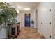 Welcoming foyer with elegant tile flooring and a stylish console table with decorative mirror at 550 W Powell Way, Chandler, AZ 85248