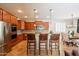 Modern kitchen with stainless steel appliances, granite countertops, and comfortable bar seating at 550 W Powell Way, Chandler, AZ 85248