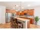 Well-equipped kitchen featuring stainless steel appliances, granite counters, and a stylish breakfast bar at 550 W Powell Way, Chandler, AZ 85248