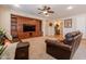 Comfortable living room featuring a custom built-in media center and ample seating at 550 W Powell Way, Chandler, AZ 85248