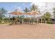 Community playground featuring a sand pit and climbing structures for outdoor activities at 550 W Powell Way, Chandler, AZ 85248