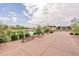 Scenic community pond with lush landscaping, walking path, and seating, creating a serene outdoor space at 550 W Powell Way, Chandler, AZ 85248