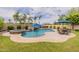 Inviting pool area featuring a rock waterfall, spa, and outdoor seating perfect for relaxing and entertaining at 550 W Powell Way, Chandler, AZ 85248