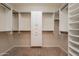 The walk-in closet offers ample storage with custom shelving and well-designed layout at 550 W Powell Way, Chandler, AZ 85248