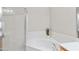 Bright bathroom features a soaking tub and separate shower with glass doors at 6002 N 5Th Pl, Phoenix, AZ 85012