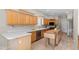 Well-lit kitchen features light countertops, wood cabinets, and tile flooring at 6002 N 5Th Pl, Phoenix, AZ 85012