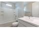 Well-lit bathroom featuring a combination tub and shower with a white vanity at 613 W Winchester Dr, Chandler, AZ 85286