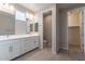 Bright bathroom features a double vanity, tile floors, and separate toilet room at 613 W Winchester Dr, Chandler, AZ 85286