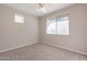 Cozy carpeted bedroom featuring two windows allowing plenty of natural light at 613 W Winchester Dr, Chandler, AZ 85286