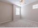 Cozy carpeted bedroom featuring two windows allowing plenty of natural light at 613 W Winchester Dr, Chandler, AZ 85286