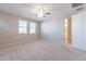 Spacious bedroom with a ceiling fan, natural light, and en suite bathroom at 613 W Winchester Dr, Chandler, AZ 85286