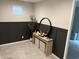 Stylish entryway featuring a decorative console table, mirror, and wainscoting accent wall at 613 W Winchester Dr, Chandler, AZ 85286