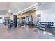 Well-equipped gym with weight machines, free weights, and wall-mounted televisions at 613 W Winchester Dr, Chandler, AZ 85286