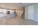 Open-concept living space featuring a modern kitchen with stainless steel appliances and a staircase at 613 W Winchester Dr, Chandler, AZ 85286