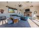 Indoor lounge area features ample seating, a cozy fireplace, and bright natural light at 613 W Winchester Dr, Chandler, AZ 85286