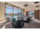 Indoor/outdoor lounge area with comfortable seating, a pool view, and a sliding barn door at 613 W Winchester Dr, Chandler, AZ 85286