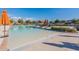 Large, bright pool with lounge seating and nearby neighborhood at 613 W Winchester Dr, Chandler, AZ 85286
