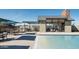 Poolside lounge featuring a covered seating area with an outdoor grill for relaxation and entertainment at 613 W Winchester Dr, Chandler, AZ 85286