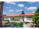 Beautiful backyard featuring a patio, lawn, desert landscaping, and a fountain at 6301 S Tournament Ln, Chandler, AZ 85249