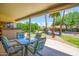 Inviting backyard patio area with mature landscaping and seating at 6301 S Tournament Ln, Chandler, AZ 85249