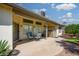 View of the home's backyard with a patio, landscaping, and a storage shed at 6301 S Tournament Ln, Chandler, AZ 85249