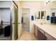 Main bathroom featuring double sinks, a vanity area, and a separate shower at 6301 S Tournament Ln, Chandler, AZ 85249