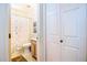 Compact bathroom with a shower-tub combo and floral shower curtain at 6301 S Tournament Ln, Chandler, AZ 85249