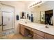 Spacious bathroom with a long vanity, large mirrors, and separate shower area at 6301 S Tournament Ln, Chandler, AZ 85249