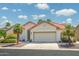 Charming single-Gathering home with desert landscaping and a two-car garage, red tile roof, and neutral stucco exterior at 6301 S Tournament Ln, Chandler, AZ 85249