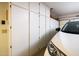 Garage with ample storage cabinets and a white Toyota parked inside at 6301 S Tournament Ln, Chandler, AZ 85249