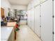 Versatile room with built-in storage, an arched window, and ample workspace at 6301 S Tournament Ln, Chandler, AZ 85249