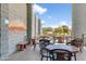 Outdoor seating area with tables and chairs, overlooking the golf course at 6301 S Tournament Ln, Chandler, AZ 85249