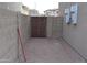 Brick paved back patio with gated access to the alleyway, and privacy wall at 6620 W Shaw Butte Dr, Glendale, AZ 85304