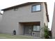 Back view of the home with covered patio, and enclosed backyard at 6620 W Shaw Butte Dr, Glendale, AZ 85304