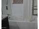 Well-maintained bathroom with a bathtub, shower, and tiled walls, providing a comfortable and functional space at 6620 W Shaw Butte Dr, Glendale, AZ 85304