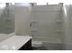 Bathroom featuring a shower-tub combo and dark cabinetry at 6620 W Shaw Butte Dr, Glendale, AZ 85304